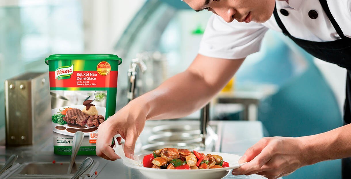 Asian chef prepare to serve shaking beef